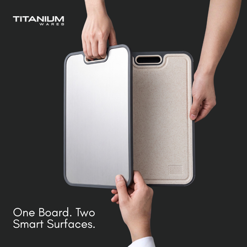 Hands flipping the double-sided cutting board from the titanium side to the wheat straw side