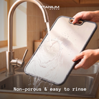Rinsing the non-porous titanium cutting board under the tap