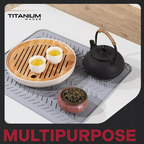 Tea set and teapot on the silicone mat used as a trivet