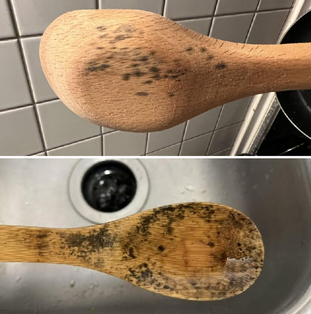 Two old wooden spoons with black mold spots - porous wood holds stains and bacteria